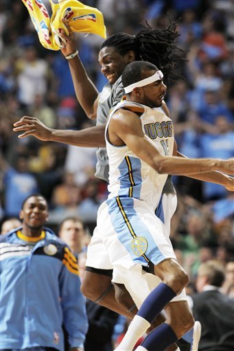After Scoring A Three-point Basket, Denver Nuggets Forward Corey Brewer, Front, Celebrates