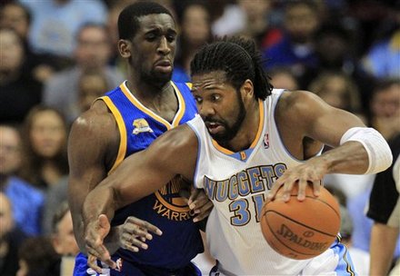 Denver Nuggets Center Nene (31), From Brazil, Drives