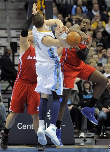 Denver Nuggets Center Timofey Mozgov (25) From Russia Has The Ball Knocked From His Hands By Los Angeles Clippers