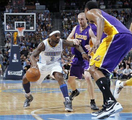 Denver Nuggets Guard Ty Lawson, Left, Looks
