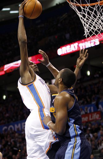 Oklahoma City Thunder Forward Kevin Durant, Left, Shoots