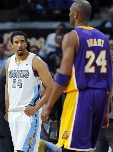 As Los Angeles Lakers Guard Kobe Bryant, Front, Heads