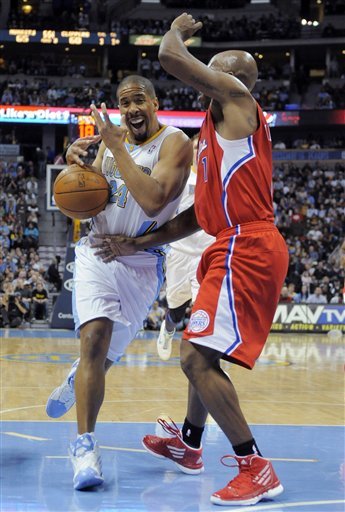 Denver Nuggets Guard Andre Miller (24) Is Looses The Ball As He Drives Against Los Angeles Clippers Guard Chauncey