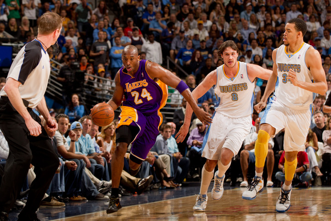 Kobe Bryant #24 Of The Los Angeles Lakers Dribbles The Ball Up The Court Against Danilo Gallinari #8 Of The Denver