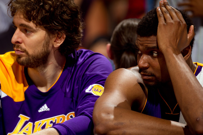 Pau Gasol #16 Of The Los Angeles Lakers (L) And Andrew Bynum #17 React From The Bench Against The Denver Nuggets In