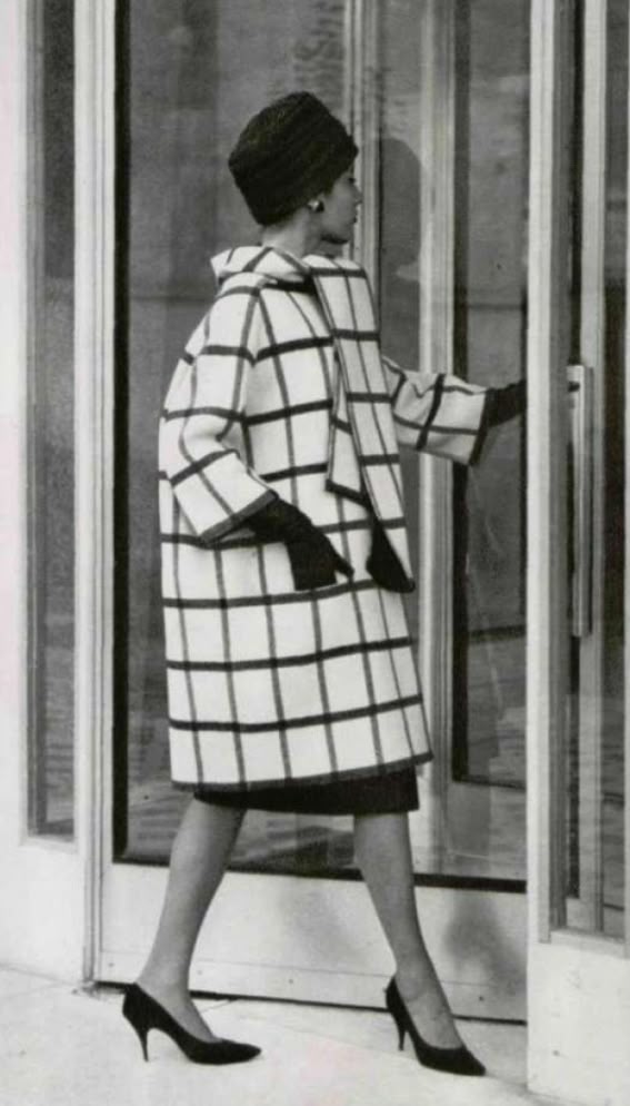 1959 Model in 910th white wool coat with large black tiles, features loosely tied removable scarf, by Givenchy, photo by Pottier,