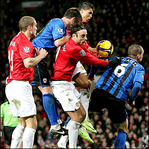 Manchester United and Middlesbrough players challenge for the ball