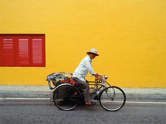  Genial looking man on bicycle rickshaw, Chinatown