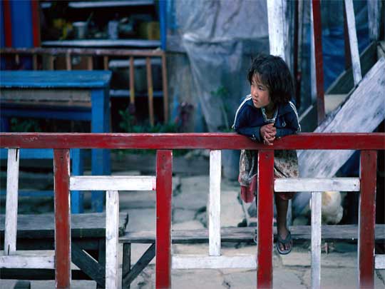  Young Nepali girl watching a passing procession, Ghorapani, around Pokhara