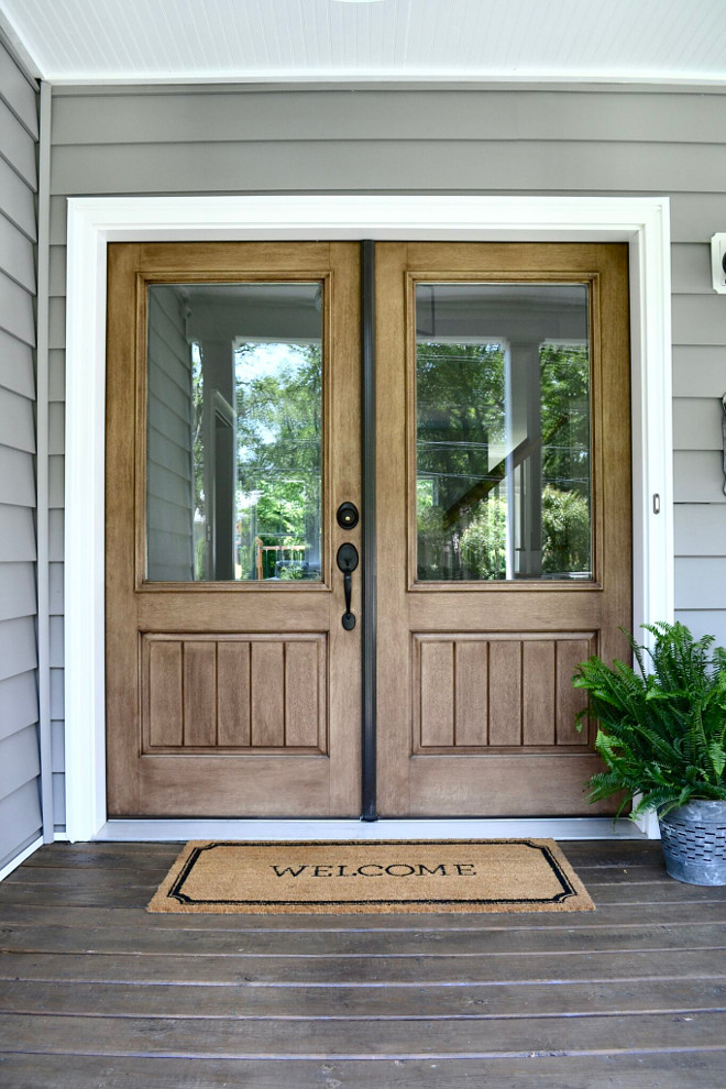 Double Front Doors. One of my favorite features of our entry is our double doors. The wood tones add warmth and character to our porch and we chose the clear glass panes to add extra light to our home. #Doublefrontdoors #wooddoors Home Bunch's Beautiful Homes of Instagram @sweetthreadsco
