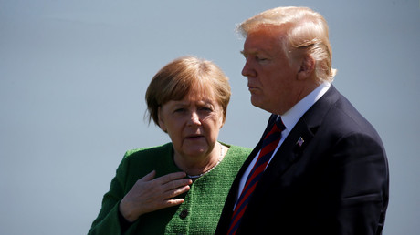 Germany's Chancellor Angela Merkel talks with US President Donald Trump at the G7 summit in Charlevoix, Quebec, Canada, on June 8, 2018. © Leah Millis
