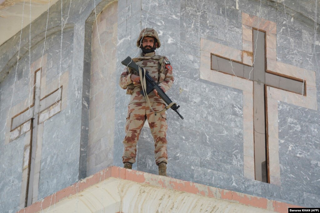 A Frontier Constabulary guard stands watch during an Easter Sunday Mass at the Bethel Memorial Methodist Church in Quetta, Pakistan.