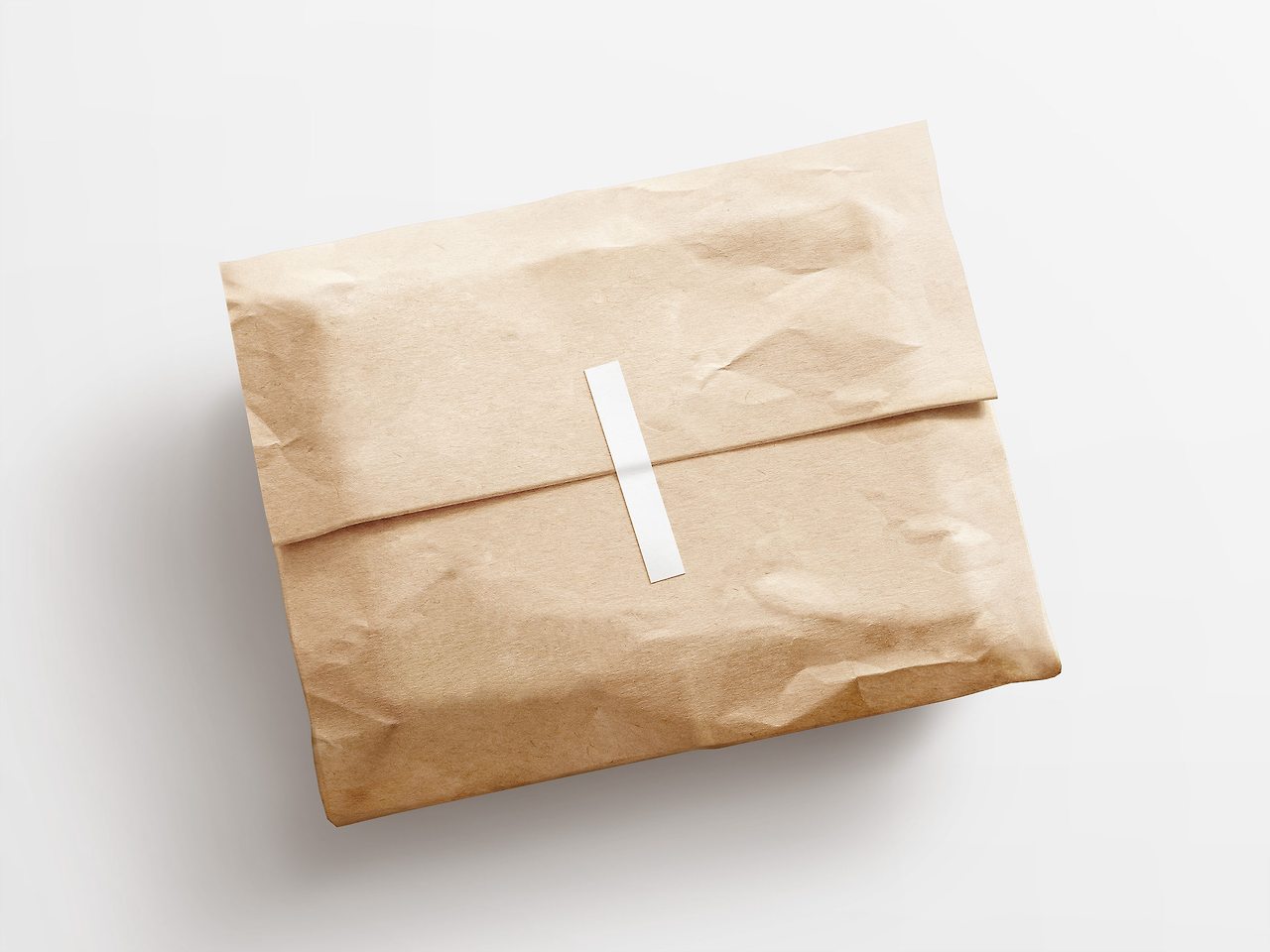 61043107fb34223cd294e00a_Kraft%20Paper%20Postal%20Bag%20%26%20Sticker%20Mockup-2500-1.jpg