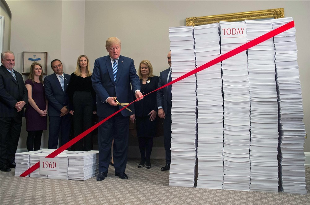 171214-trump-cuts-red-tape-ew-257p_0237805f7c034f65a63fabd2345ea110.fit-1000w[1].jpg