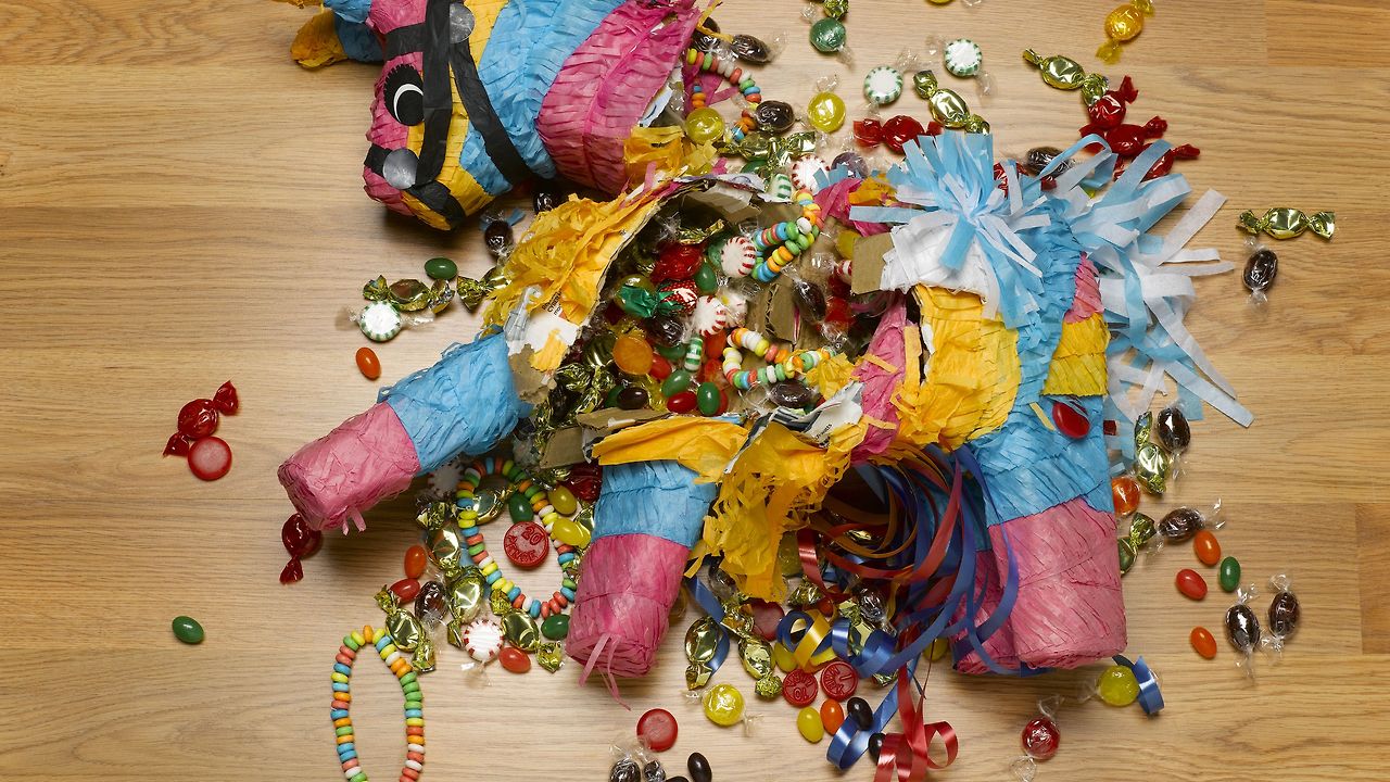 smashed-donkey-pinata-on-floor-with-candy-sb10064839y-001-57b7522b5f9b58cdfdcfeed0.jpg