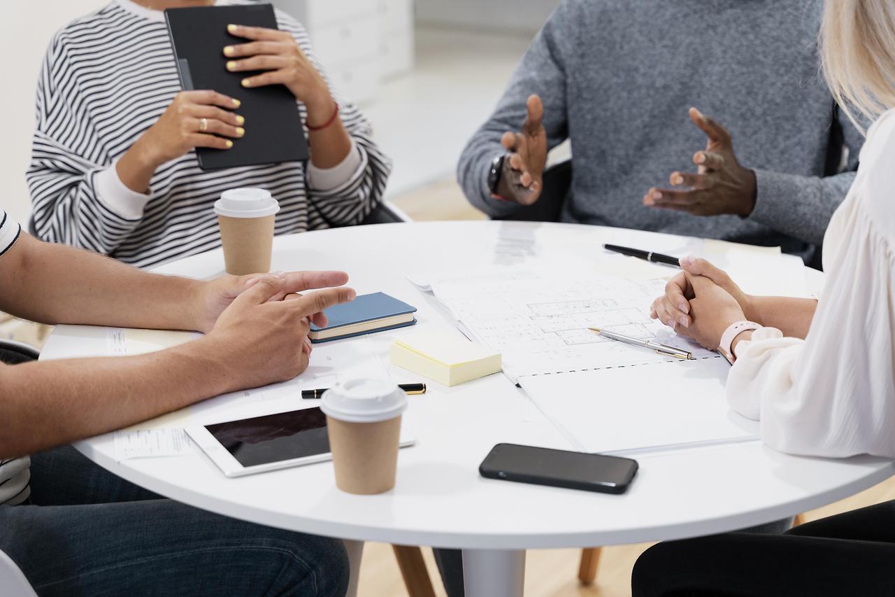close-up-young-colleagues-having-meeting.jpg