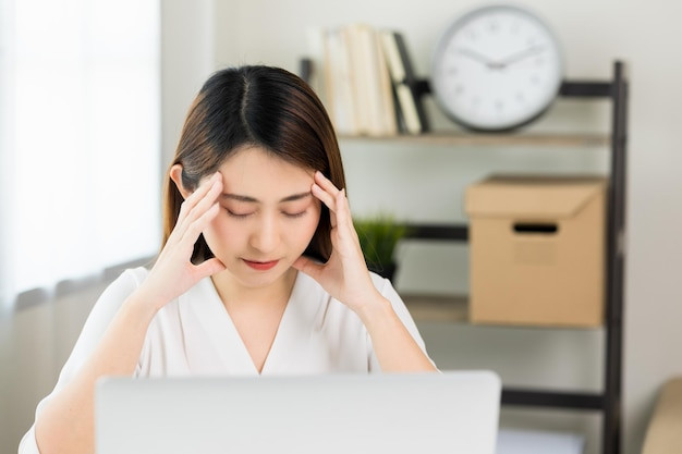 young-asian-business-woman-hand-touching-head-she-s-feeling-depressed-stress-headache-be-tired-from-working-with-laptop-long-time-she-symptom-office-syndrome_208349-1058.jpg