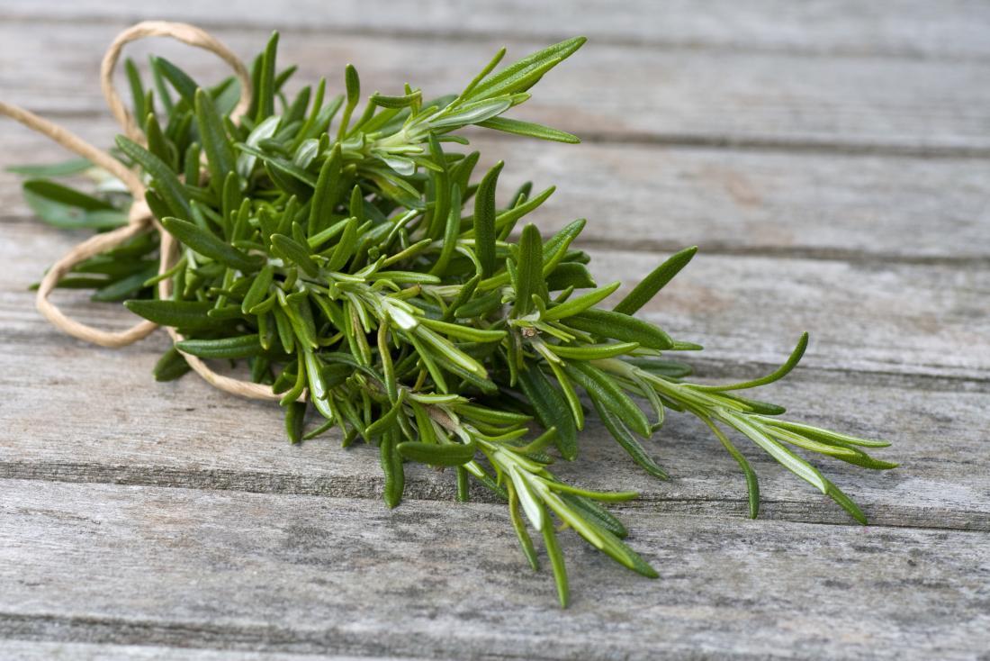 rosemary-leaves-bound-in-rope-on-wooden-table.jpg