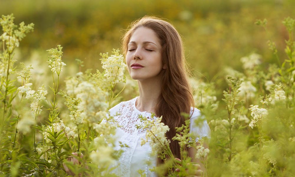 woman-smelling-flowers.jpg