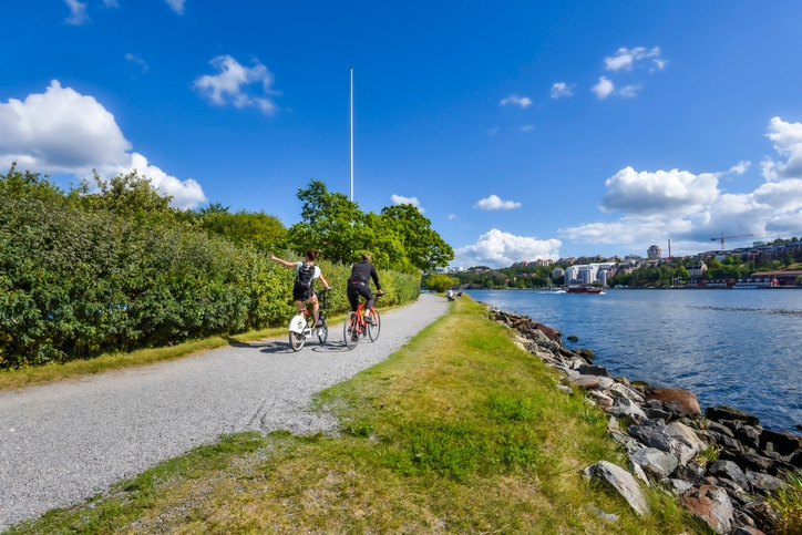 Cyclist on the water face promenade in Djurgarden island in Center of.jpg