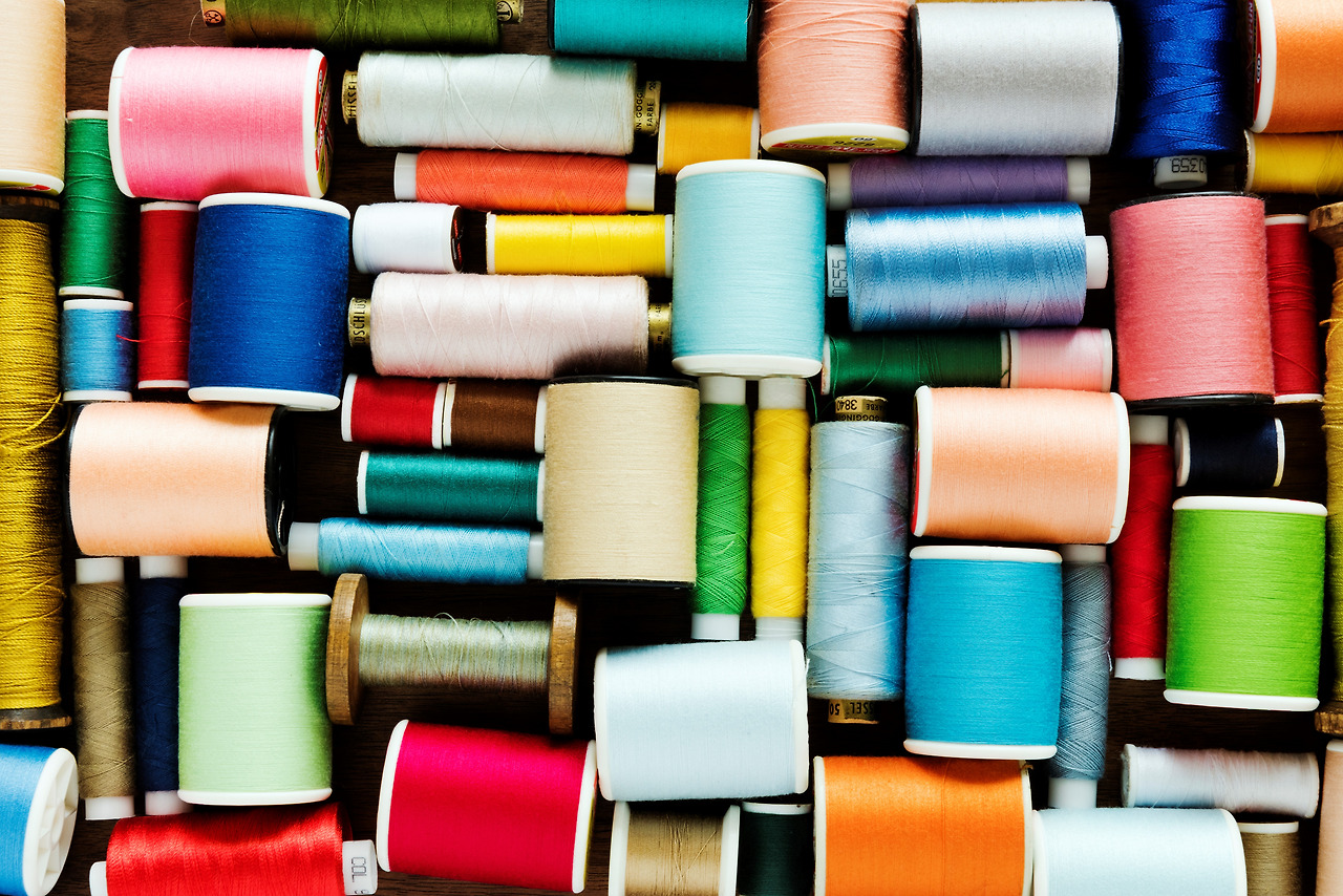 colorful-sewing-threads-background-closeup-PW23JZX.jpg