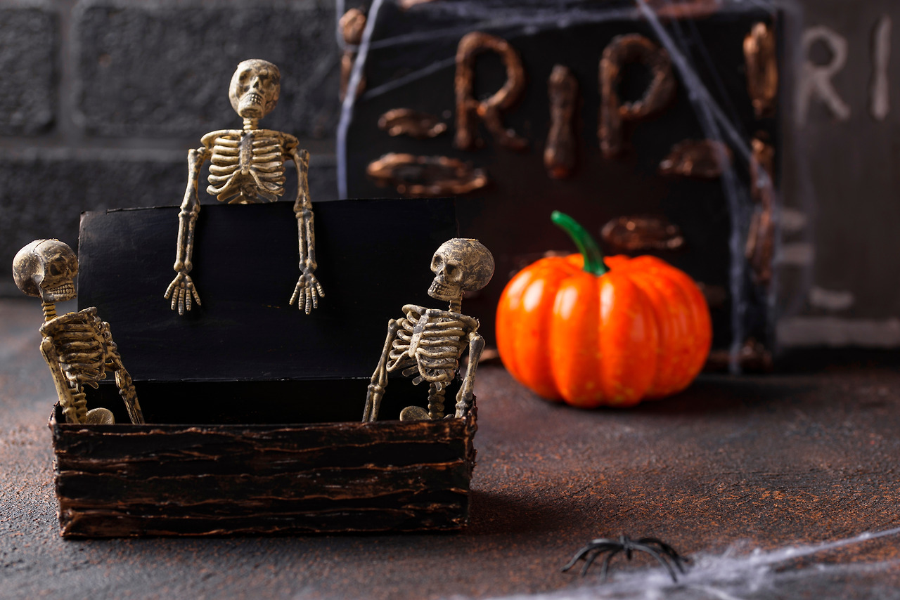 halloween-background-with-skeletons-and-tomb-8MND6GK.jpg