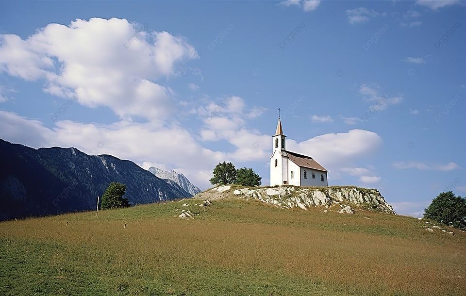 pngtree-a-small-church-on-a-hill-in-front-of-a-mountain-image_13358700.jpg