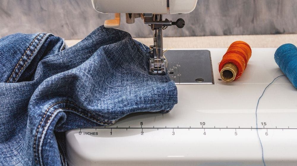 sewing-machine-foot-on-denim-scissors-how-to-alter-clothes-ss.jpg