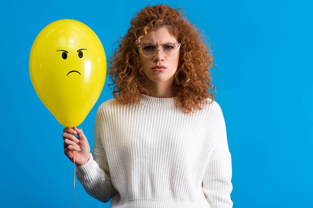 aggressive-woman-holding-yellow-balloon-with-angry-2024-11-18-11-20-08-utc.jpg
