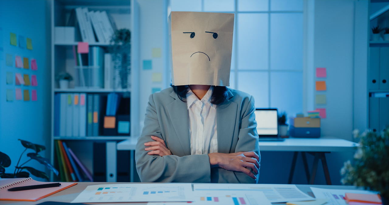 businesswoman-sit-on-desk-wear-draw-sad-mask-paper-2024-11-02-13-30-57-utc.jpg