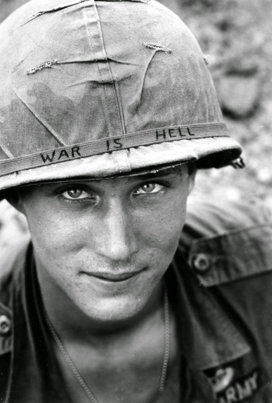 An American soldier wears a hand lettered War Is Hell slogan on his helmet, Vietnam, 1965-1.jpg