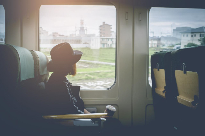 03_stock-photo-enjoying-travel-young-pretty-woman-traveling-by-the-japan-classic-train-sitting-near-the-window-452861008.jpg