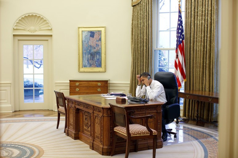 Barack_Obama_working_at_his_desk_in_the_Oval_Office.jpg