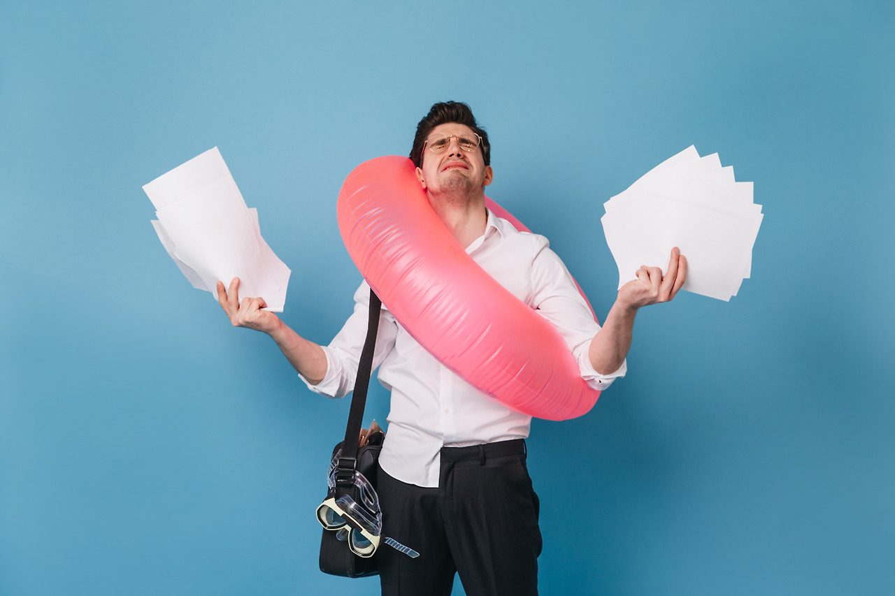 man-office-outfit-cries-holding-lot-sheets-paper-guy-wants-go-vacation-posing-with-inflatable-circle-blue-space.jpg