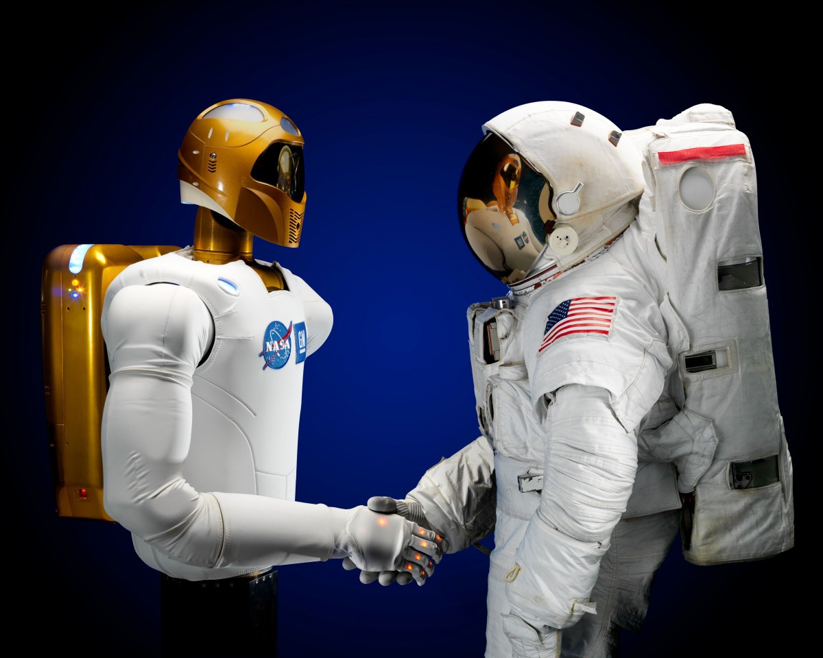 astronaut_robonaut_handshake_robot_space_spacesuit_science_technology-916835.jpg