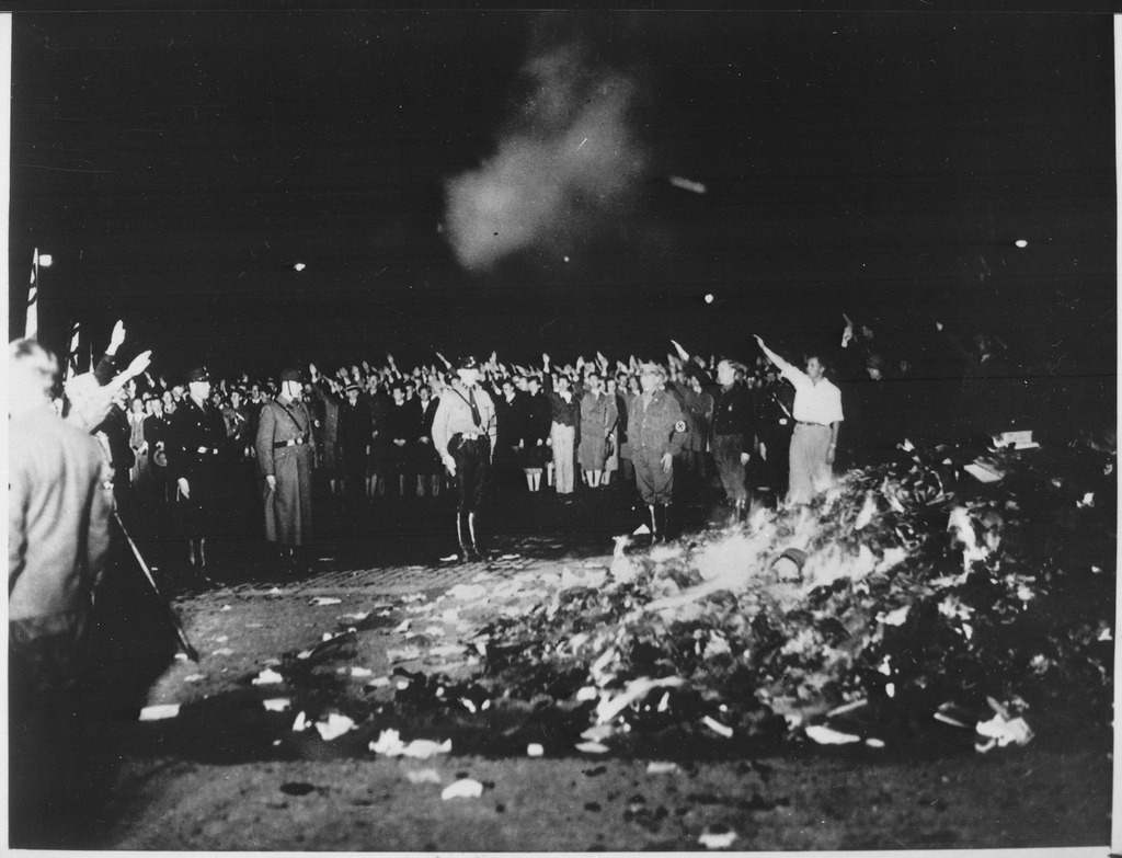 lossy-page1-1024px-Thousands_of_books_smoulder_in_a_huge_bonfire_as_Germans_give_the_Nazi_salute_during_the_wave_of_book-burnings_that..._-_NARA_-_535791.tif.jpg