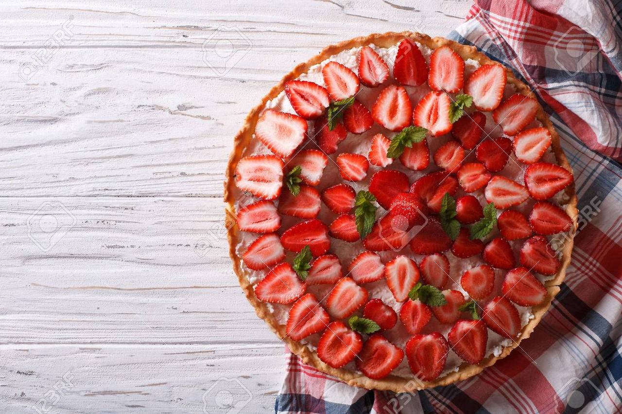 40855564-beautiful-tart-with-fresh-strawberries-mint-and-cream-cheese-on-a-table-horizontal-view-from-above.jpg