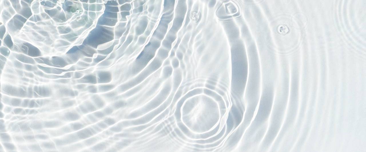 water-droplets-fall-transparent-surface-water-sunlight-top-view-flat-lay-banner (1).jpg