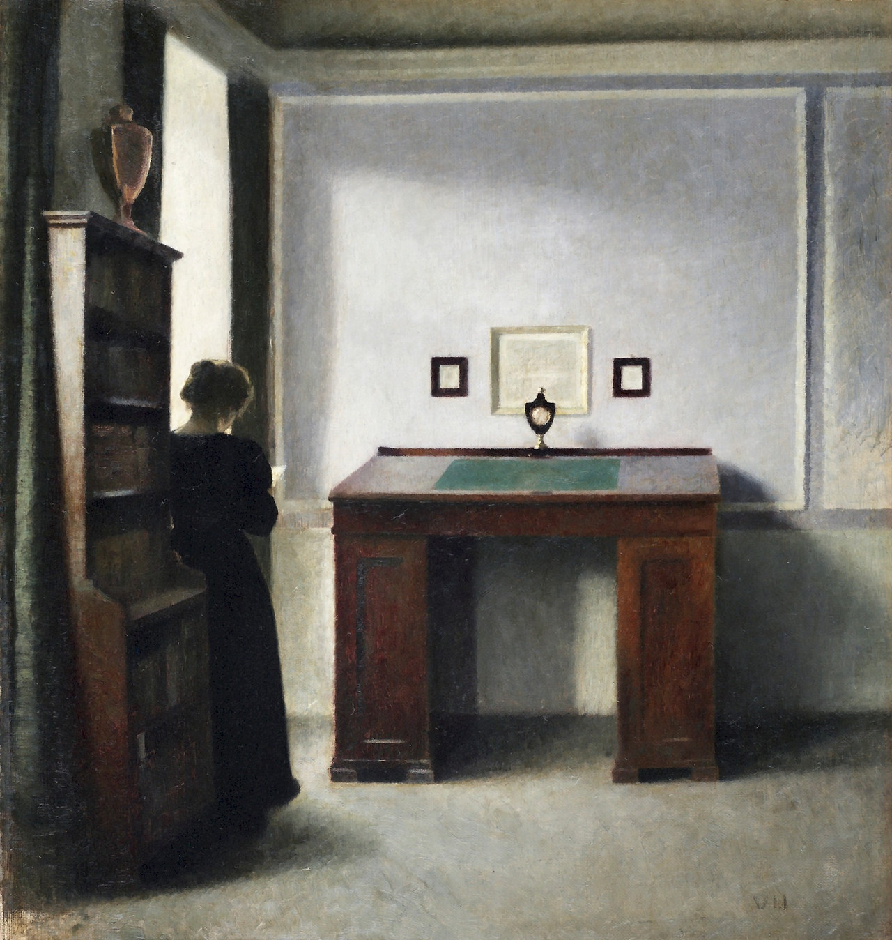 hammershoi-vilhelm---a-writing-table-and-a-young-woman-in-an-interior_19996196481_o.jpg