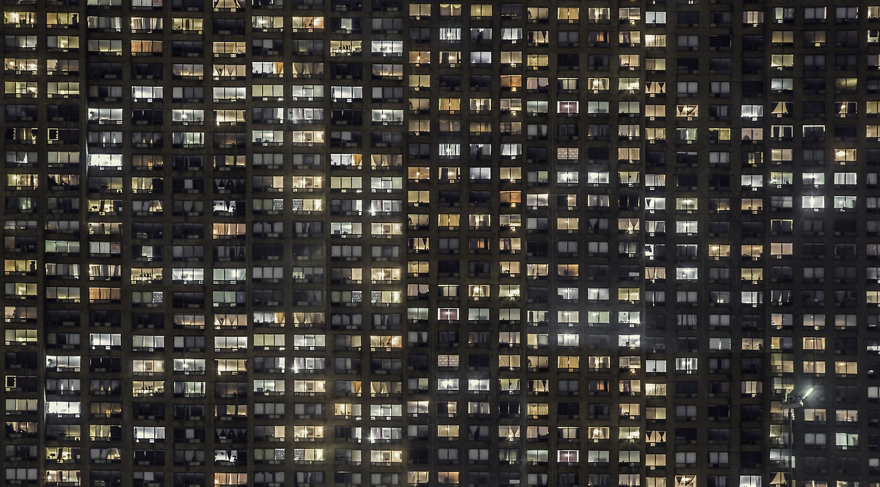 apartment-building-windows-glowing.jpg