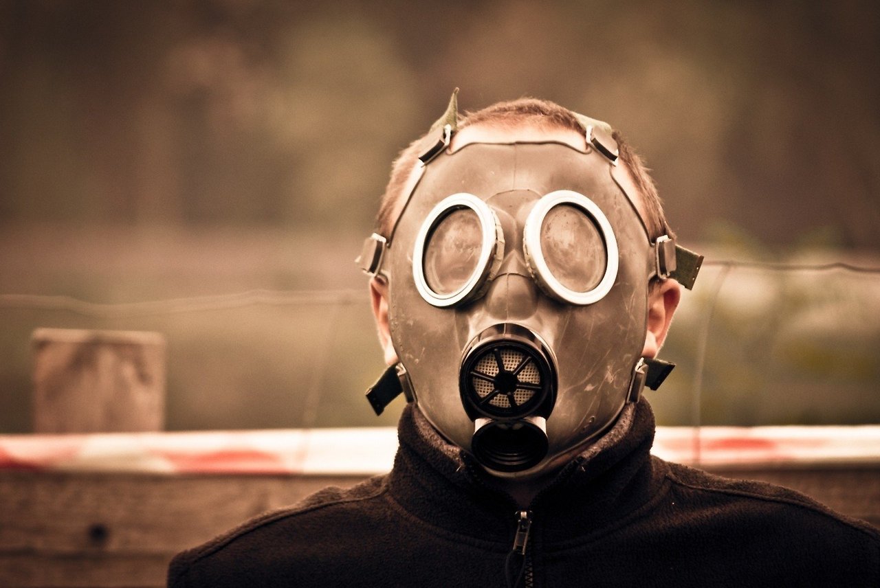 man-wearing-gas-mask-on-street.jpg