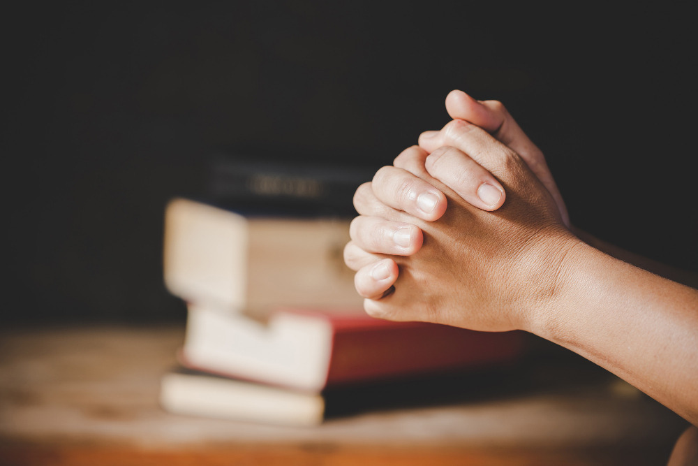 spirituality-religion-hands-folded-prayer-holy-bible-church-concept-faith (1).jpg