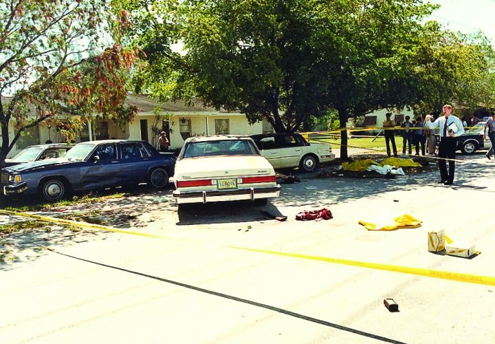 Crime_scene_photo_of_the_FBI_Miami_shootout,_showing_suspect_and_agents'_vehicles_and_battle_debris._Photo_by_Miami-Dade_PD.jpg