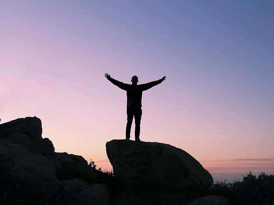 person-silhouette-sunset-rock-boulder-peak-success-dom-silence.jpg