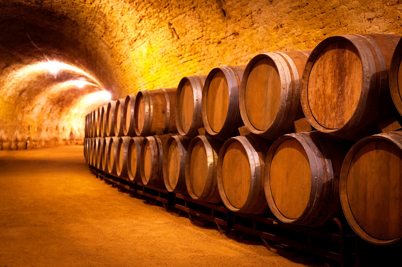 wine-aging-barrels-cellar.jpg