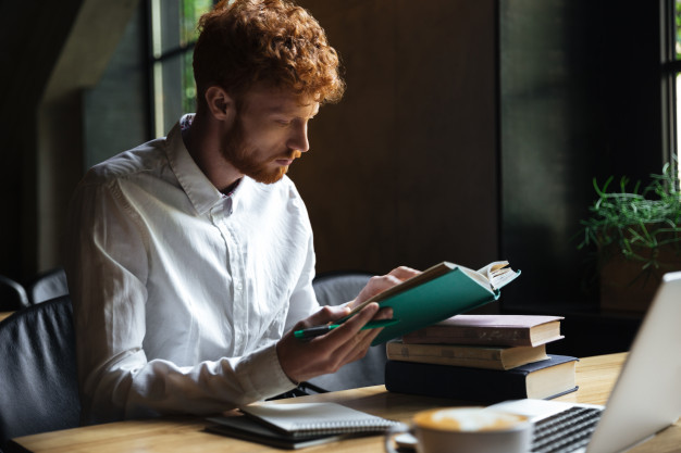 photo-concentrated-redhead-bearded-student-preparing-university-exam-cafe_171337-10013.jpg