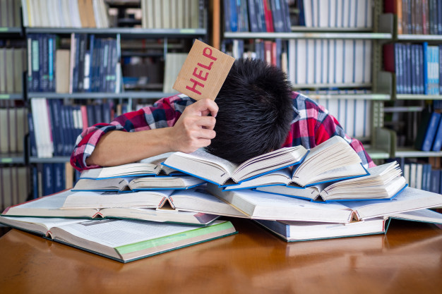 asian-male-student-is-tired-stressed-preparing-exam_112699-563.jpg