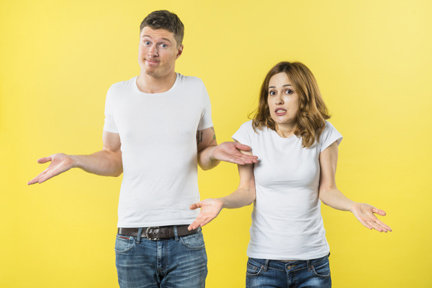 portrait-young-couple-shrugging-against-yellow-background_23-2148056108.jpg