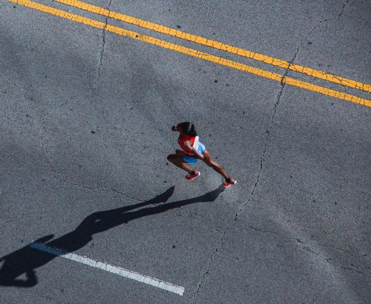 woman-athlete-running-on-marathon-.jpg