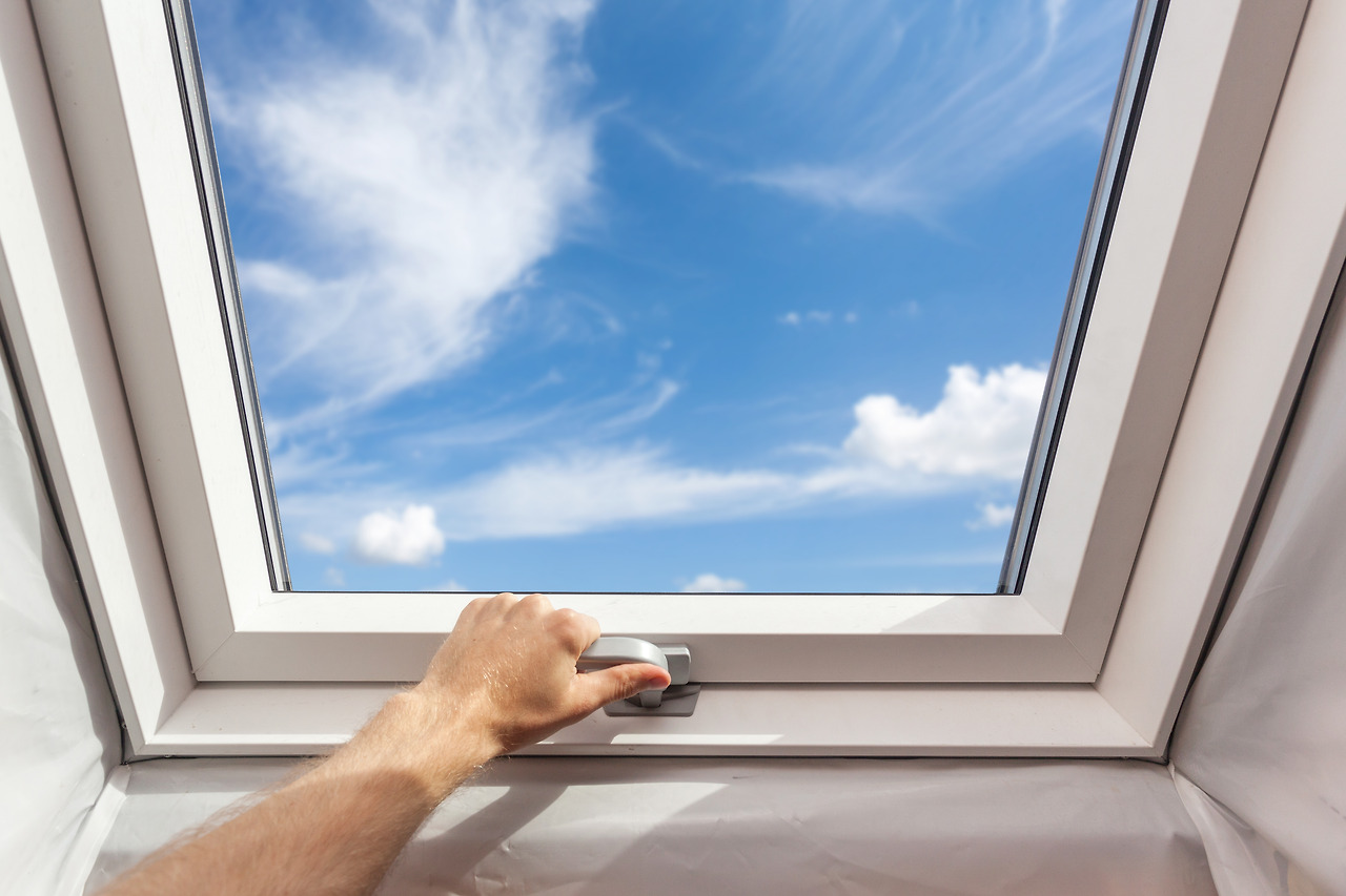 (85-2)stock-photo-man-close-new-skylight-mansard-window-in-an-attic-room-against-blue-sky-778149298.jpg